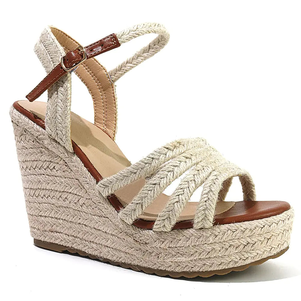 Beige wedge sandal with brown strap on a white background
