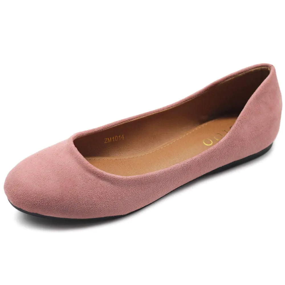 Pink flat shoe on a white background