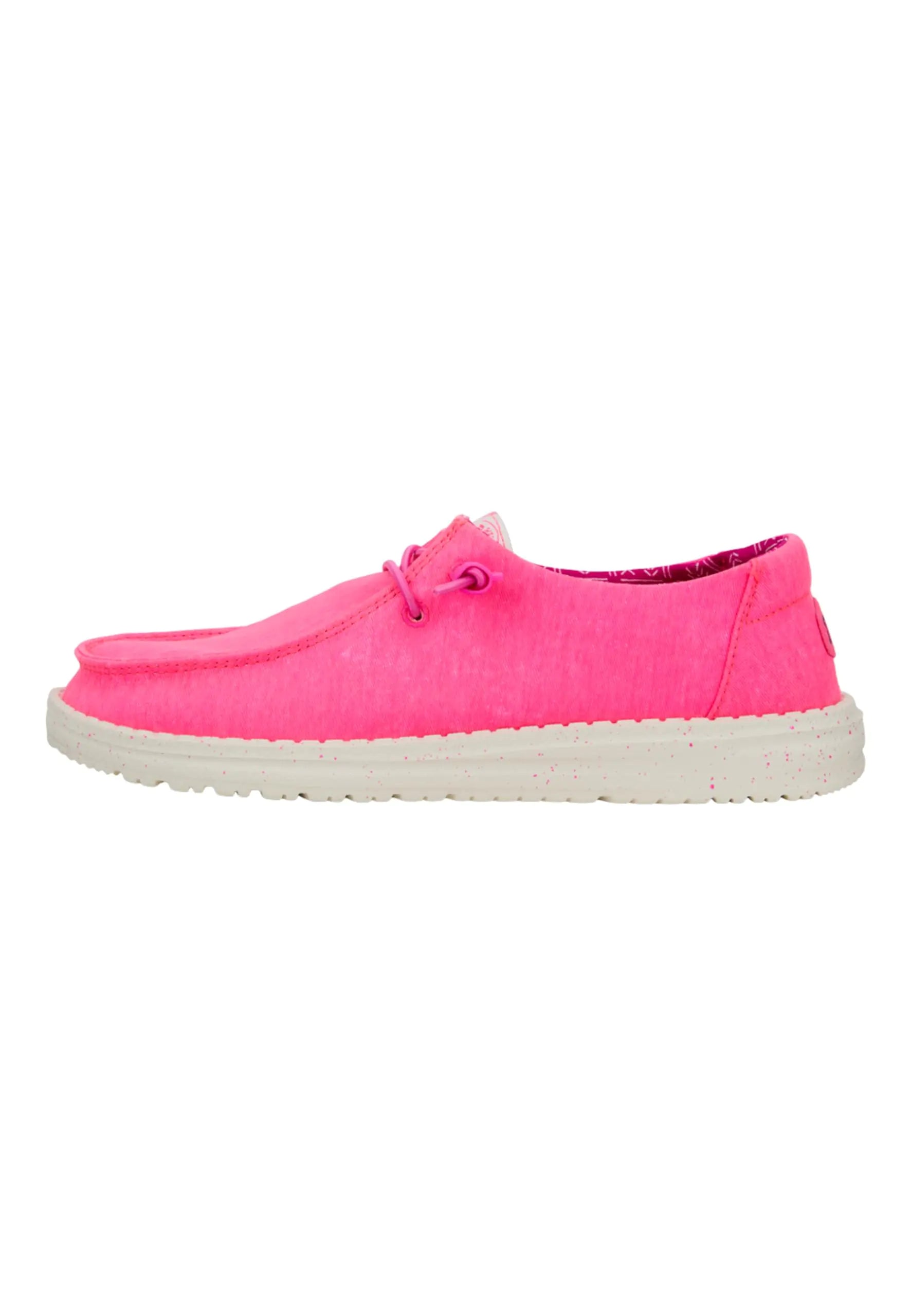 Pink slip-on shoe with a white sole on a white background