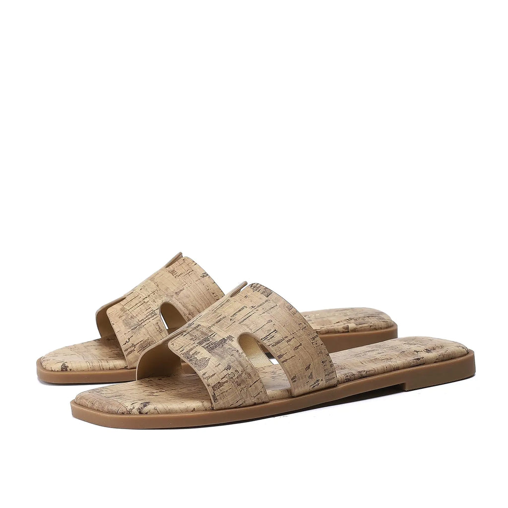 Pair of cork sandals on a white background